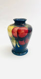 Moorcroft Small Blue Vase with Yellow and Red Fruit and Tapered Bottom