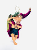 Whimsical Christmas Elf Holding a Teddy Bear