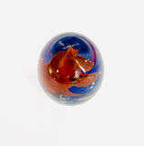 Egg Shaped Paperweight with Red Spiral Twist on a Blue Base