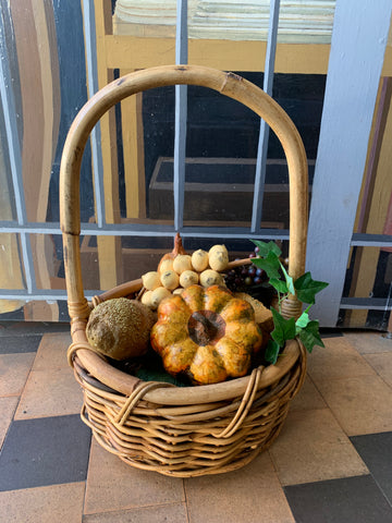 Vintage cane basket of produce