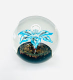 Clear Paperweight with a Unique Blue Flower with Water Droplet