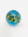 Blue Paperweight with Orange Red and White Flower in the Center