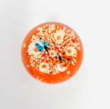 Clear Paperweight with Two Butterflies flying over white swirls