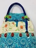 Katie Gold ceramic handbag