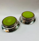 Pair of antique ornate silver plated over copper wine bottle coasters
