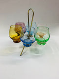 Retro multi coloured shot glass set in spinning metal holder
