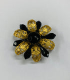 Vintage brooch with gold and black detail