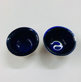 Pair of sterling silver and cobalt blue glass salt pots