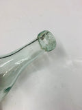 Antique glass torpedo bottle