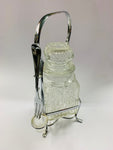 Vintage glass olive jar with fork
