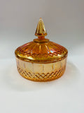 Orange carnival glass lidded bowl