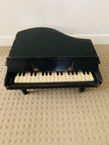 Antique child’s baby grand piano