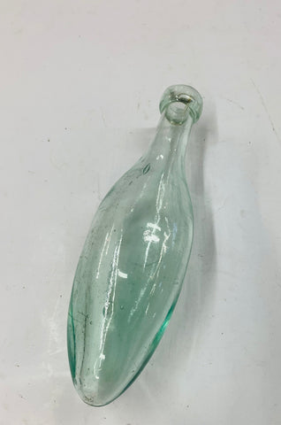 Antique glass torpedo bottle