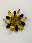 Vintage brooch with gold and black detail