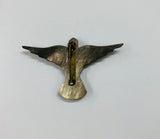 Paua Shell and mother of Pearl cross brooch on a bird