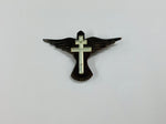 Paua Shell and mother of Pearl cross brooch on a bird