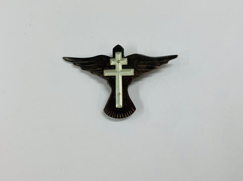 Paua Shell and mother of Pearl cross brooch on a bird