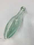 Antique glass torpedo bottle