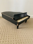 Antique child’s baby grand piano