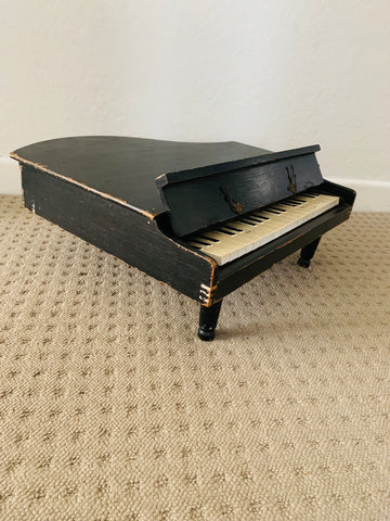 Antique child’s baby grand piano