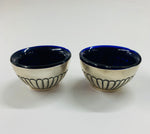 Pair of sterling silver and cobalt blue glass salt pots