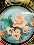 Convex vintage mirror with floral art