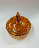 Orange carnival glass lidded bowl