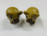 Pair of novelty pottery pig salt and pepper shakers