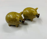 Pair of novelty pottery pig salt and pepper shakers