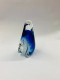 Art glass penguin with a fish inside