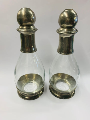 Pair of antique glass and pewter decanters