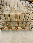 Vintage milk crate with 12 quart milk bottles