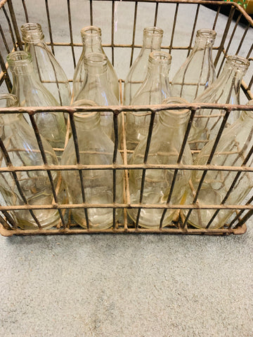 Vintage milk crate with 12 quart milk bottles